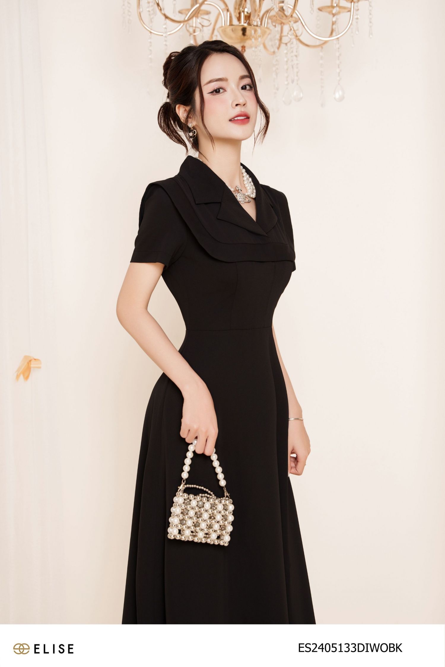 ĐẦM ĐEN CỔ VEST VIỀN CẦU NGỰC