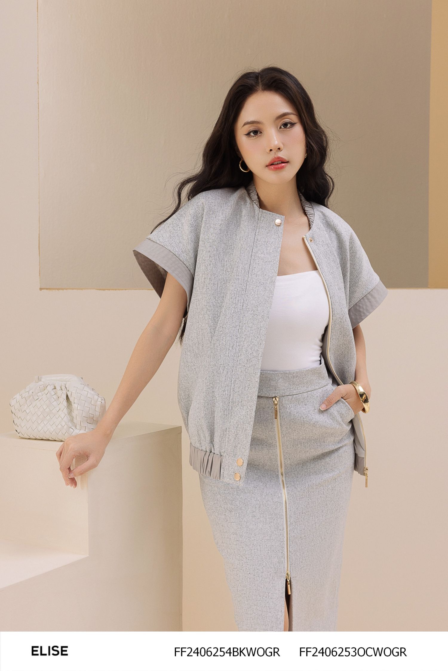 JUPE SỢI VÂN XÁM TRẮNG KHÓA ĐỒNG XẺ GIỮA
