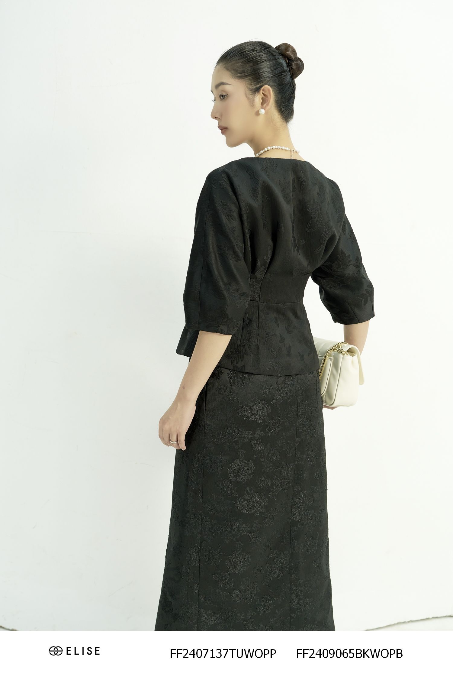 VEST GẤM ĐEN HT LÁ PEPLUM TAY LIỀN