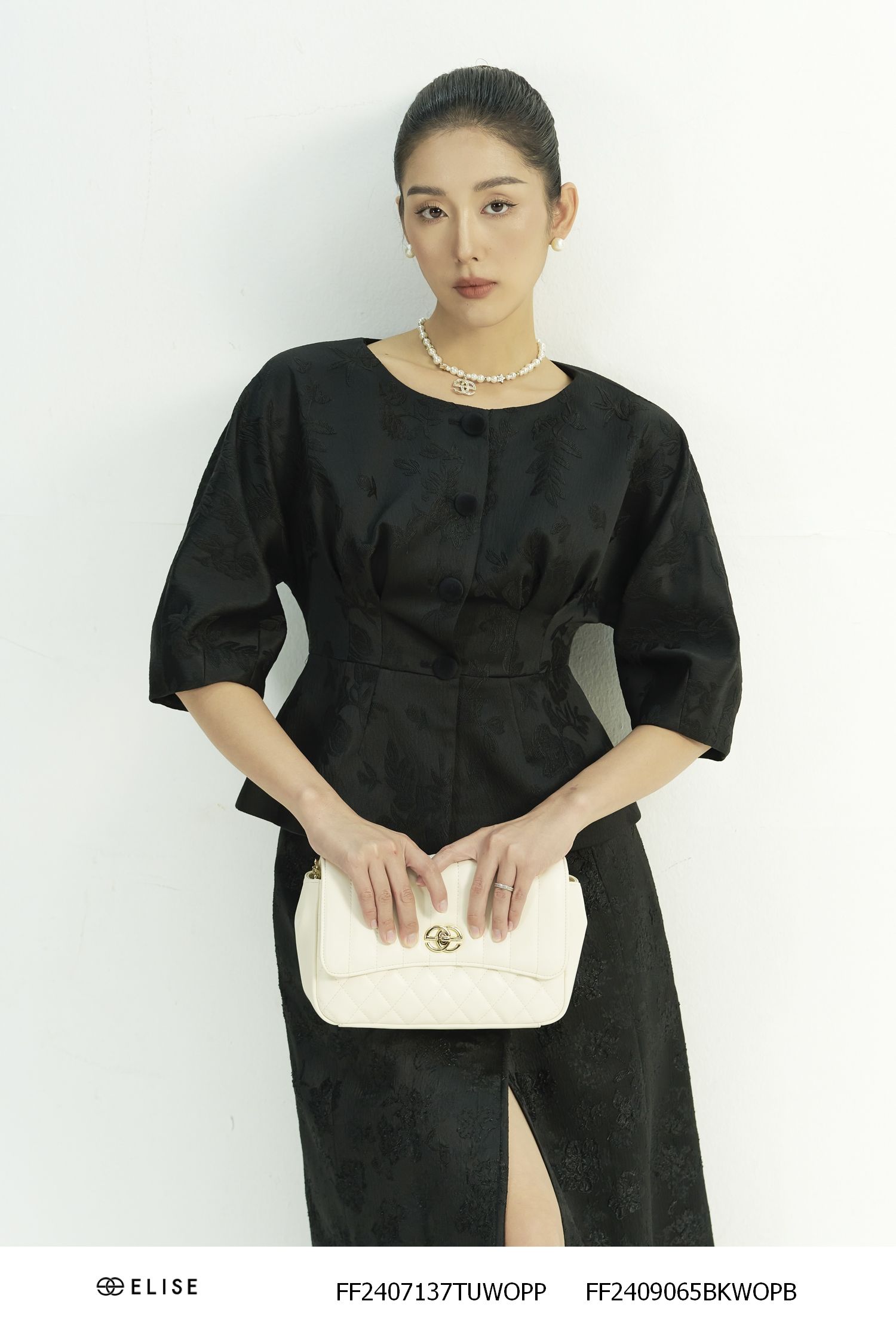 VEST GẤM ĐEN HT LÁ PEPLUM TAY LIỀN