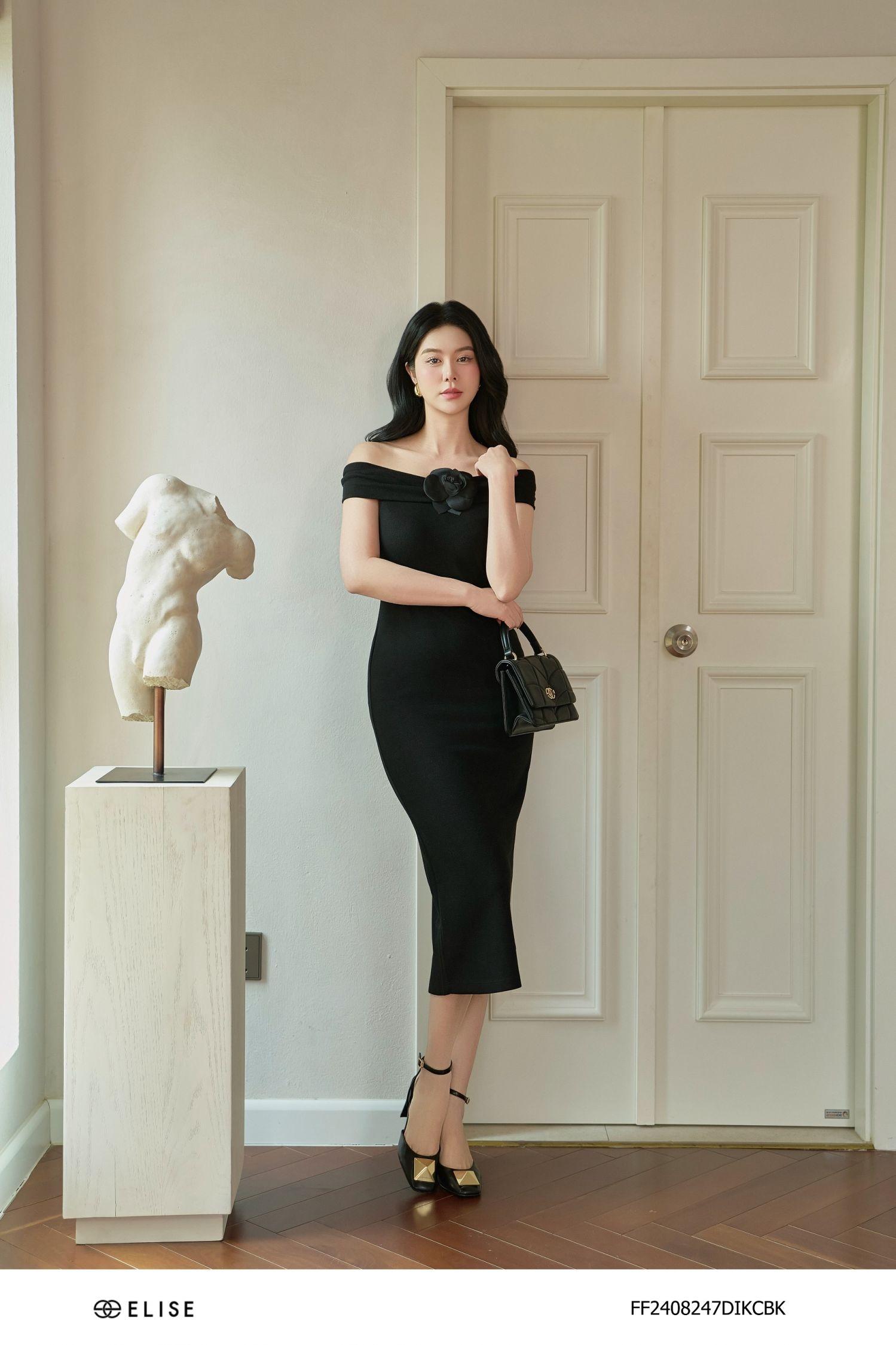 ĐẦM THUN ĐEN TRỄ VAI CÀI HOA
