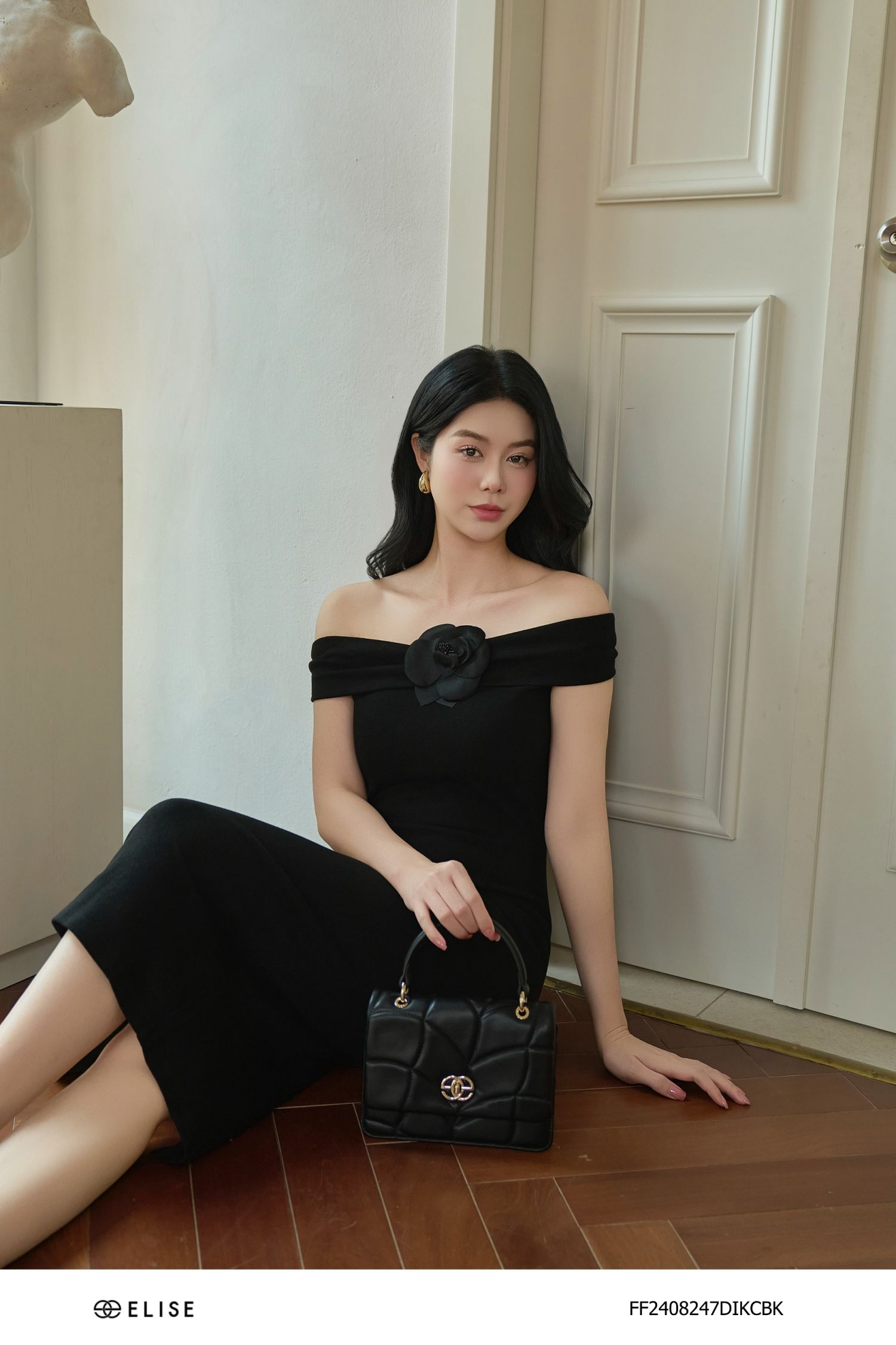 ĐẦM THUN ĐEN TRỄ VAI CÀI HOA