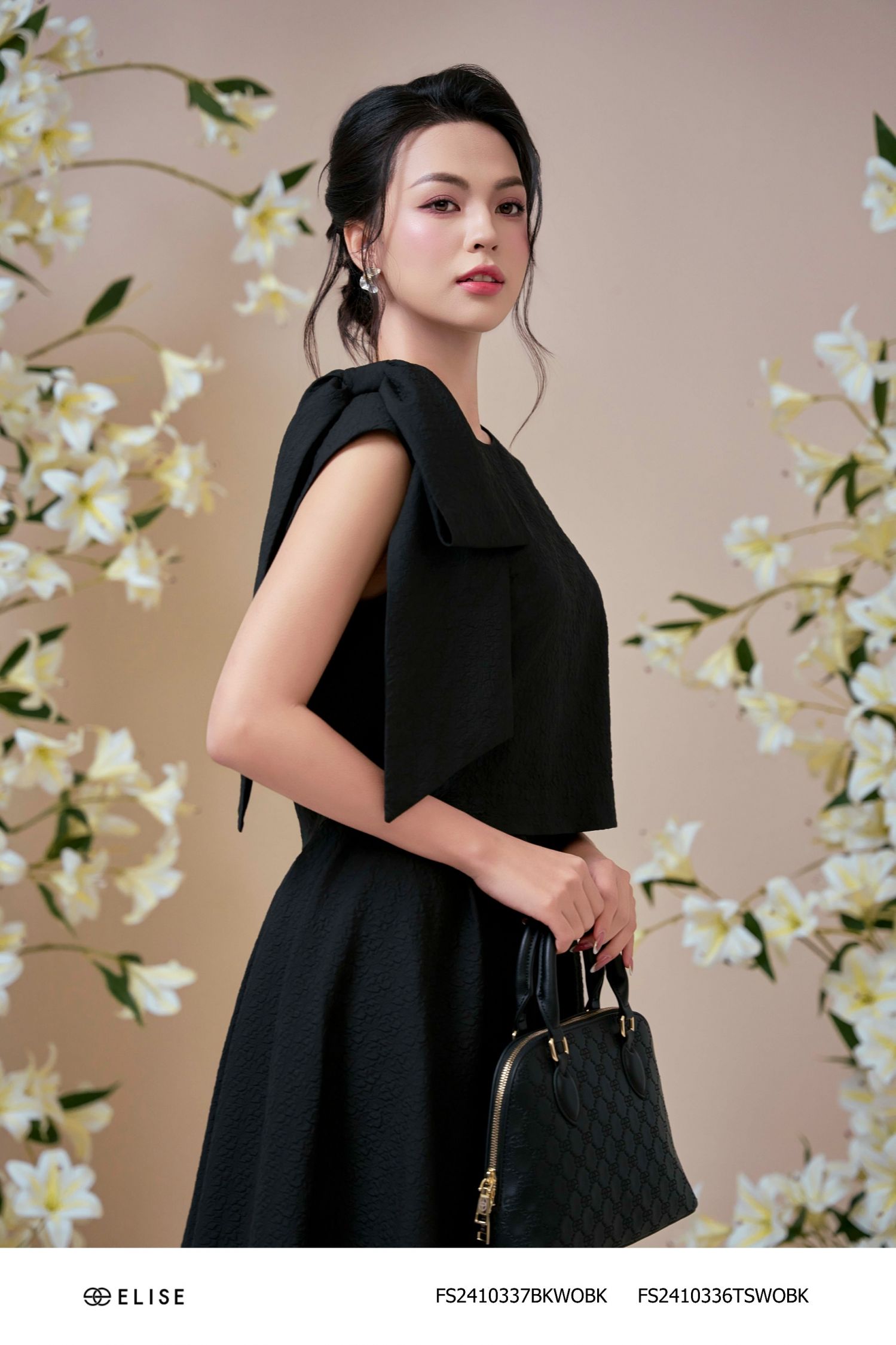 ÁO XỐP ĐEN NHĂN SÁT NÁCH NƠ VAI