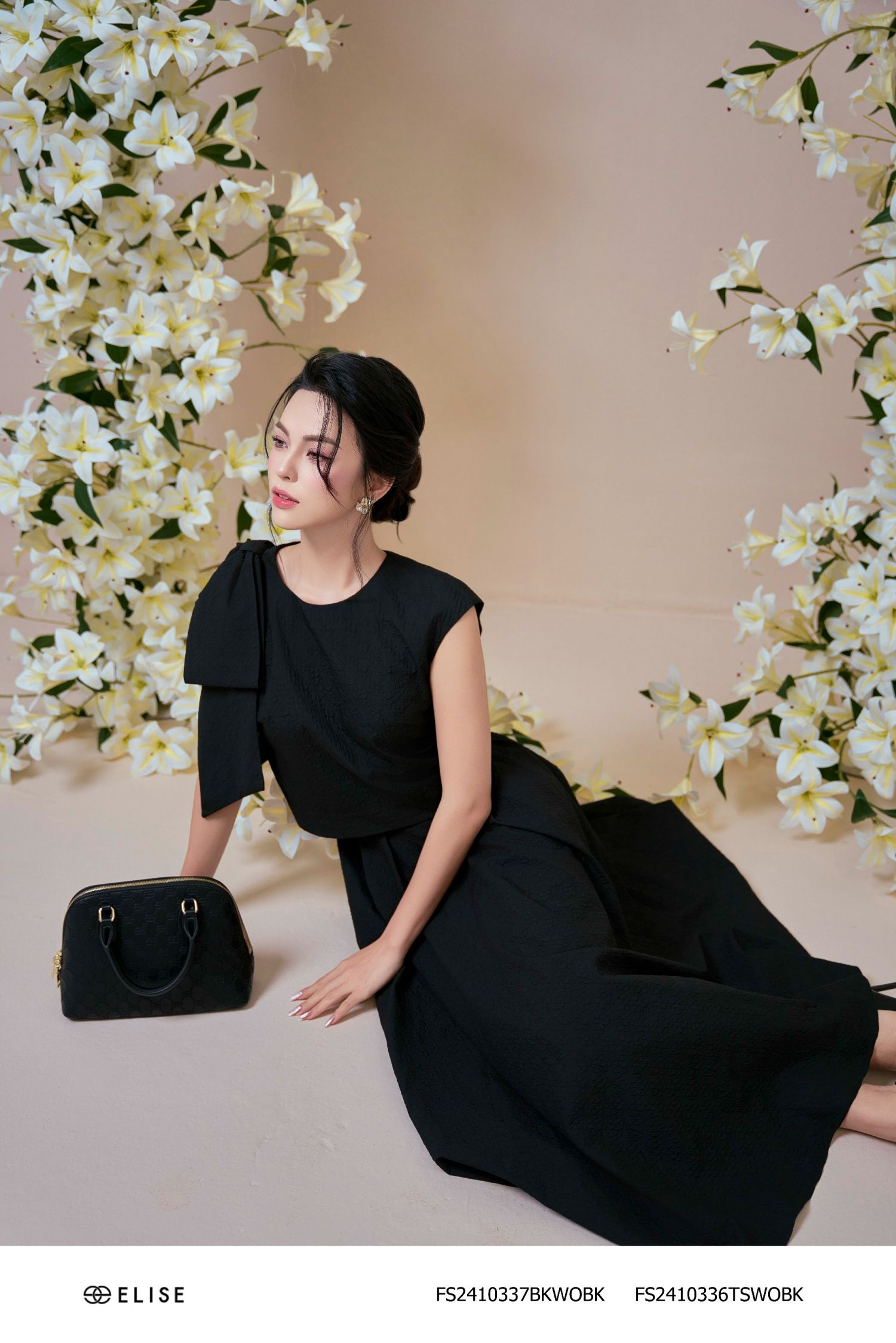 ÁO XỐP ĐEN NHĂN SÁT NÁCH NƠ VAI