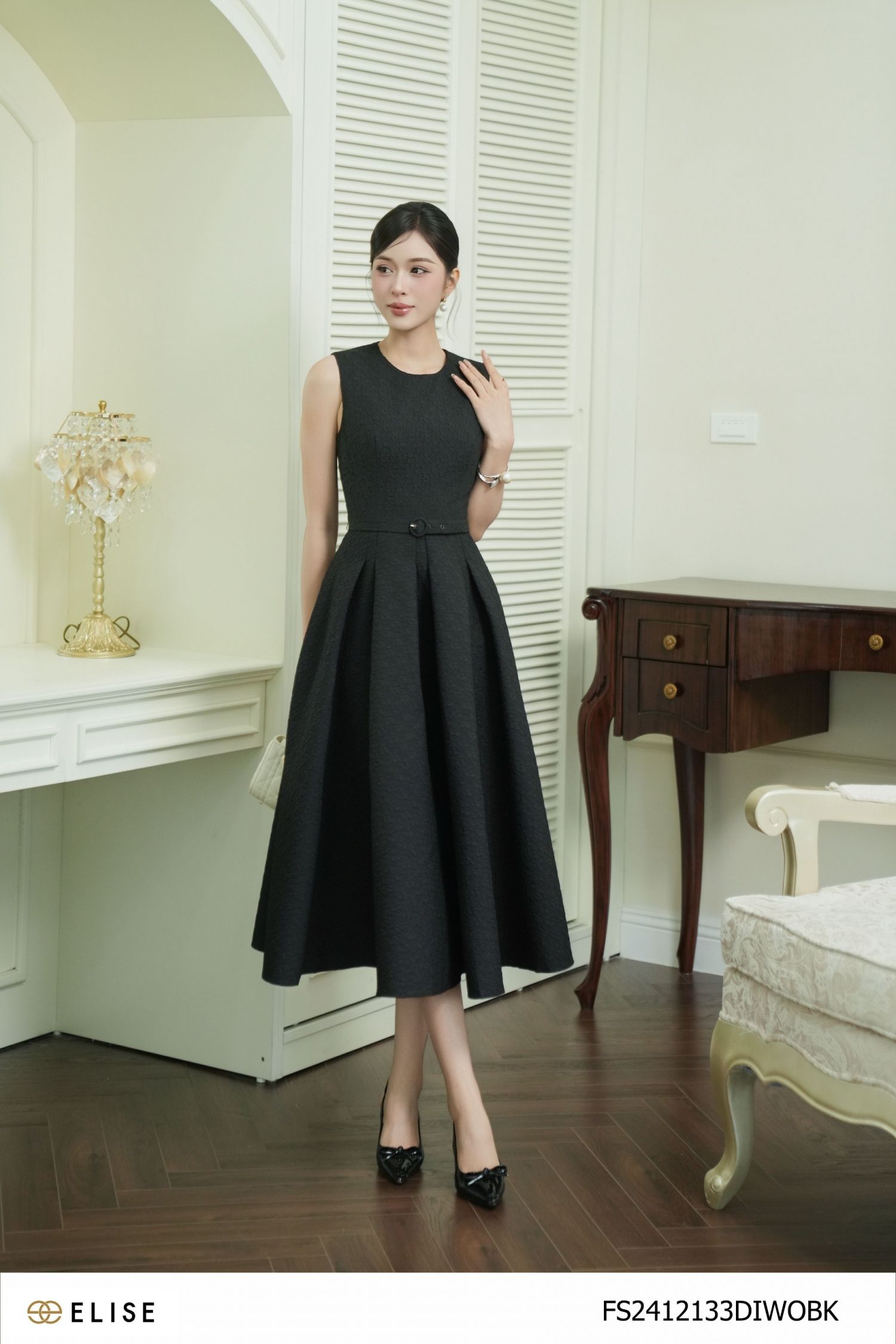 ĐẦM XỐP ĐEN HT CHÂN XẾP LY ĐAI EO