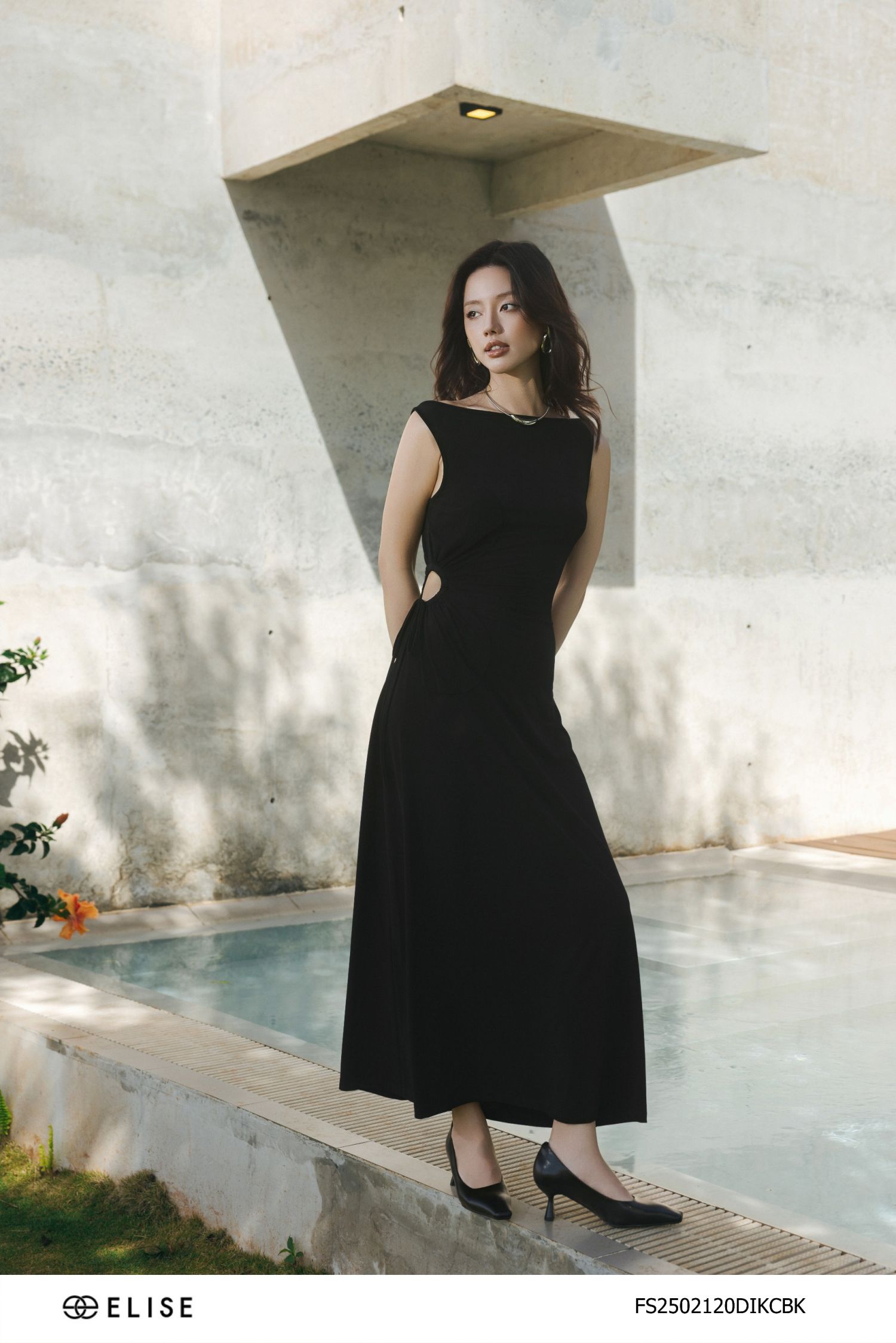 ĐẦM THUN ĐEN XẾP NHÚN HOA EO