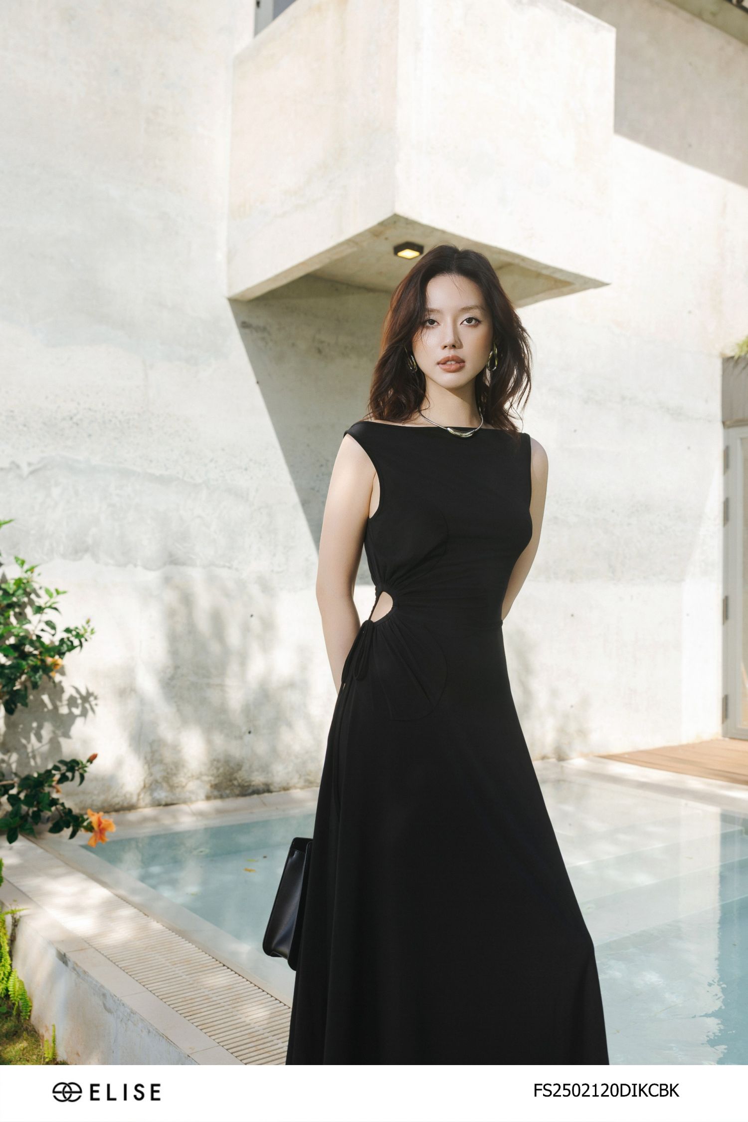 ĐẦM THUN ĐEN XẾP NHÚN HOA EO