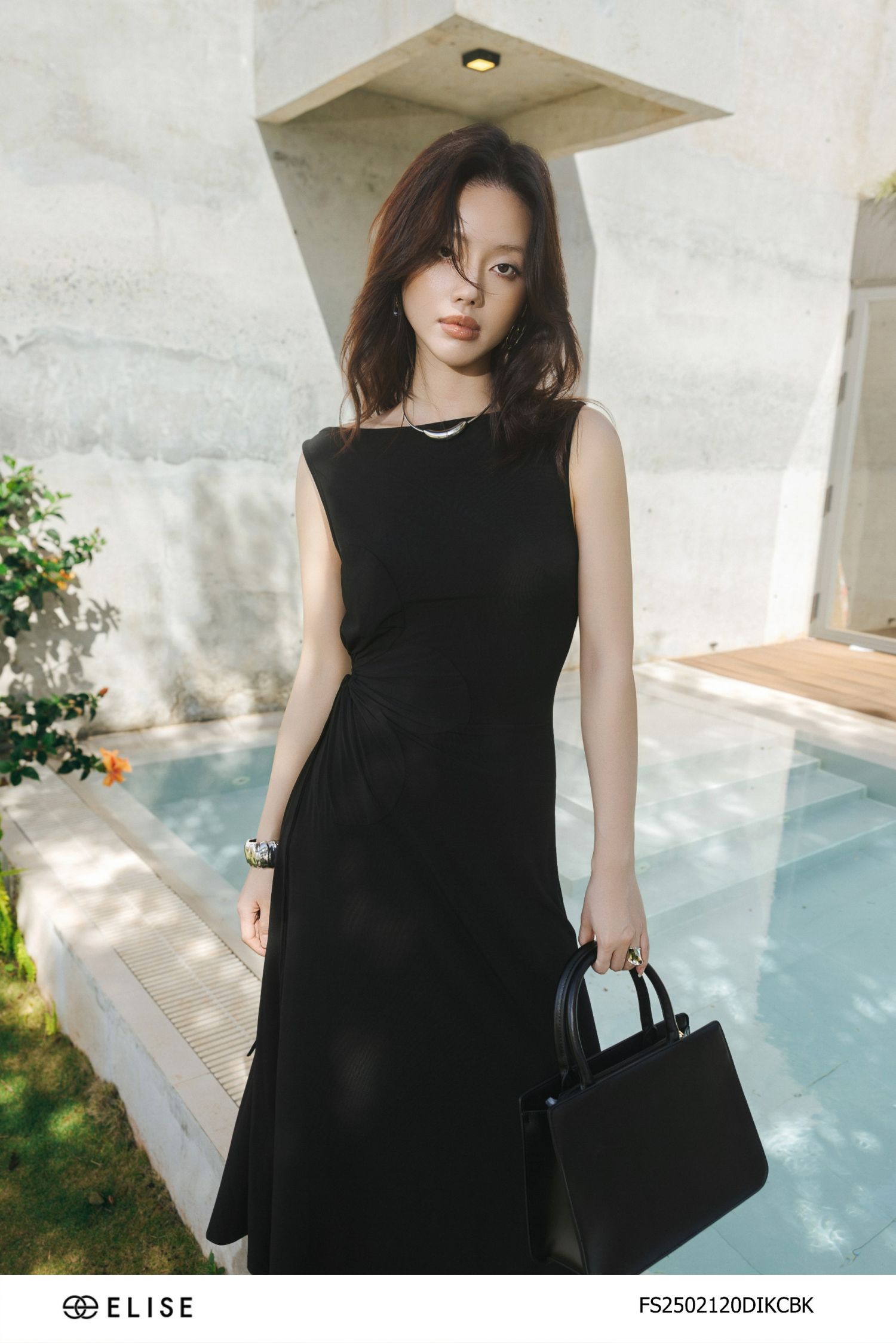ĐẦM THUN ĐEN XẾP NHÚN HOA EO